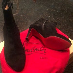 Classic booty ankle black suede Louboutin ankle boot. 2.75 heel height.